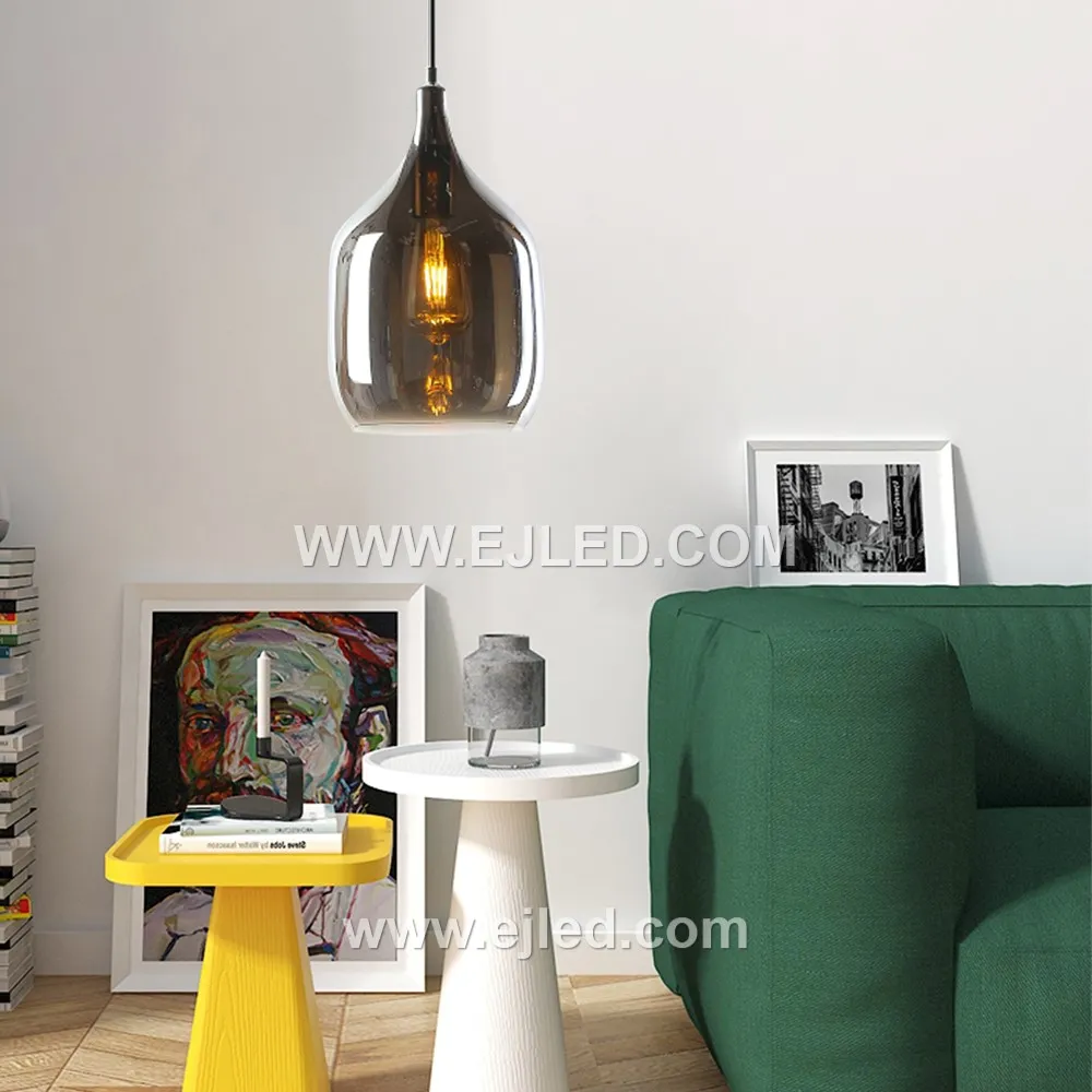 This elegant pendant features a distinctive D19*31 wine bottle-shaped glass shade in a dark, translucent finish, offering diffuse light from a single internal lamp. Its golden metal suspension provides a warm accent.