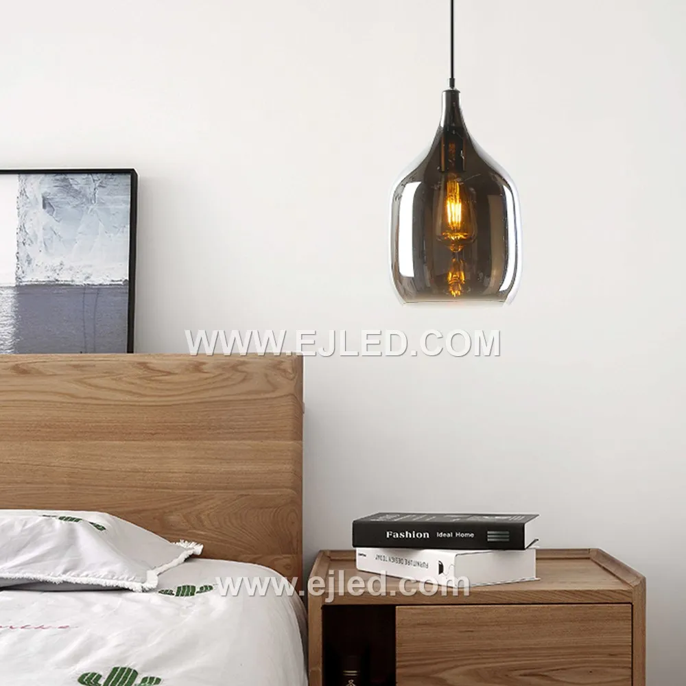 This elegant pendant features a distinctive D19*31 wine bottle-shaped glass shade in a dark, translucent finish, offering diffuse light from a single internal lamp. Its golden metal suspension provides a warm accent. - view 2