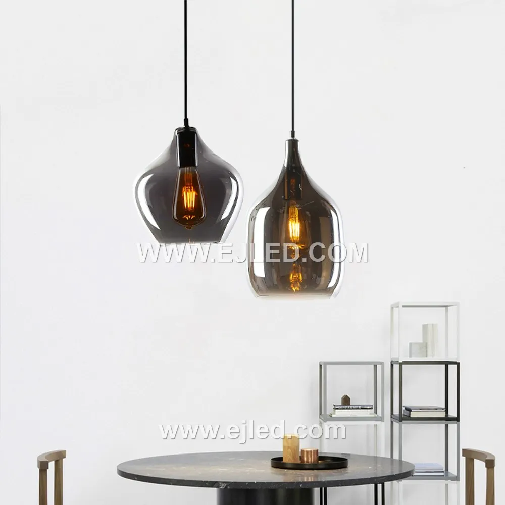This elegant pendant features a distinctive D19*31 wine bottle-shaped glass shade in a dark, translucent finish, offering diffuse light from a single internal lamp. Its golden metal suspension provides a warm accent. - view 3