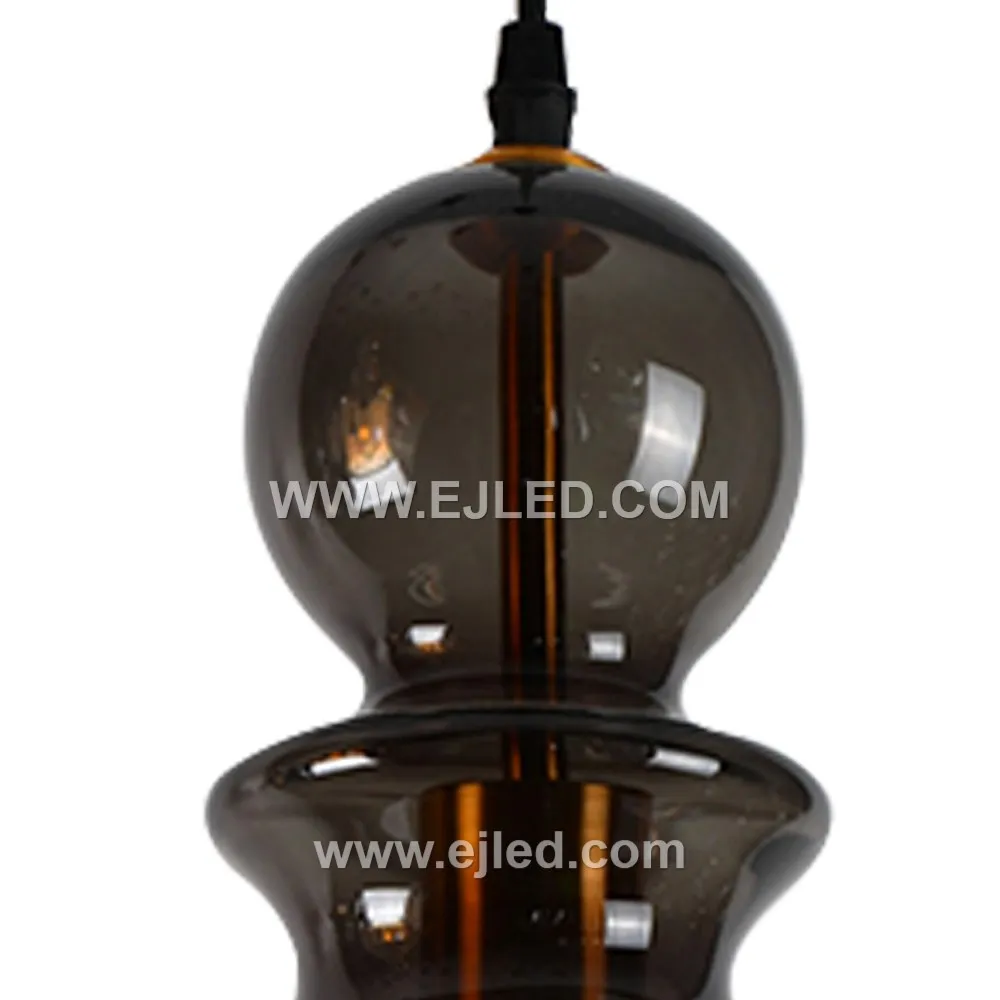 This single pendant light features a large D23*45 bell-shaped glass shade in a dark, translucent finish, offering broad, diffused illumination. Its golden-finished suspension enhances its presence. - view 3