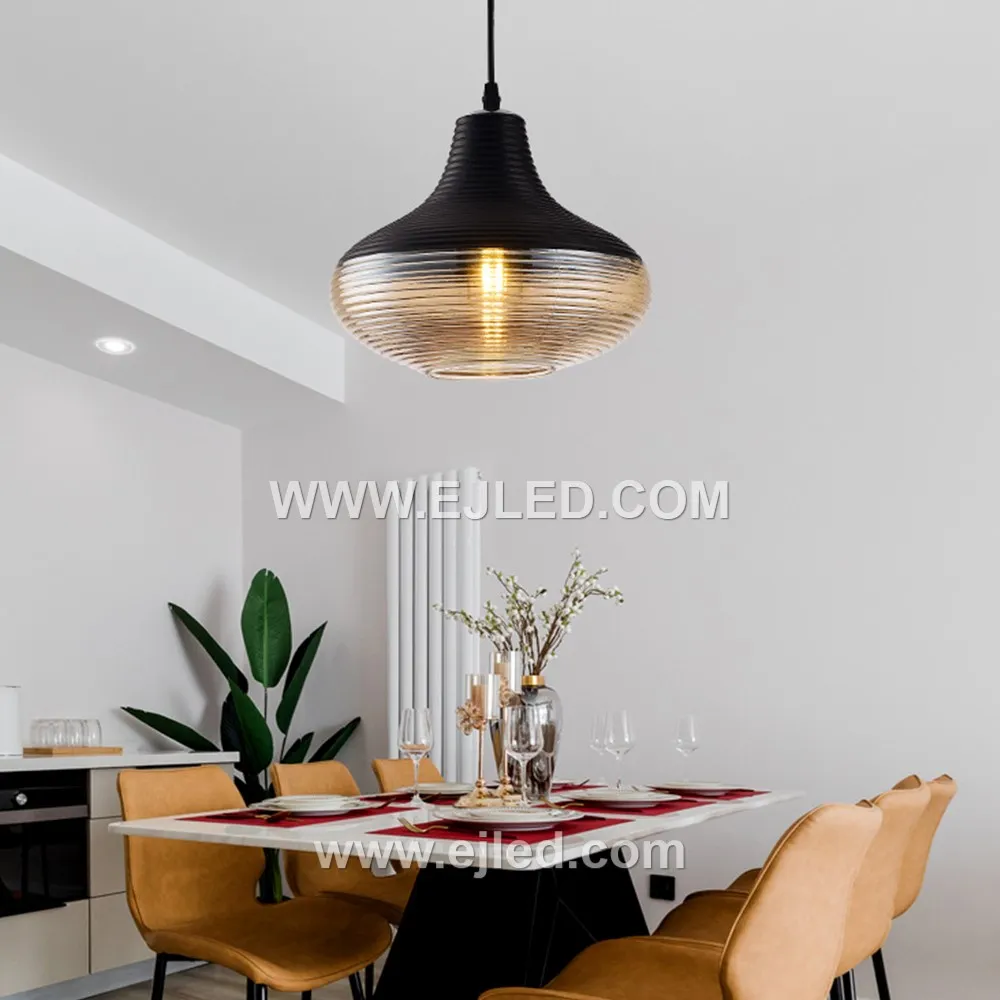 Model GL0010 offers three distinct transparent glass pendant lights: a wider dome, a tall cylinder, and a shorter, wider cylinder. These versatile shapes suit various room sizes and ceiling heights, providing flexible lighting solutions.