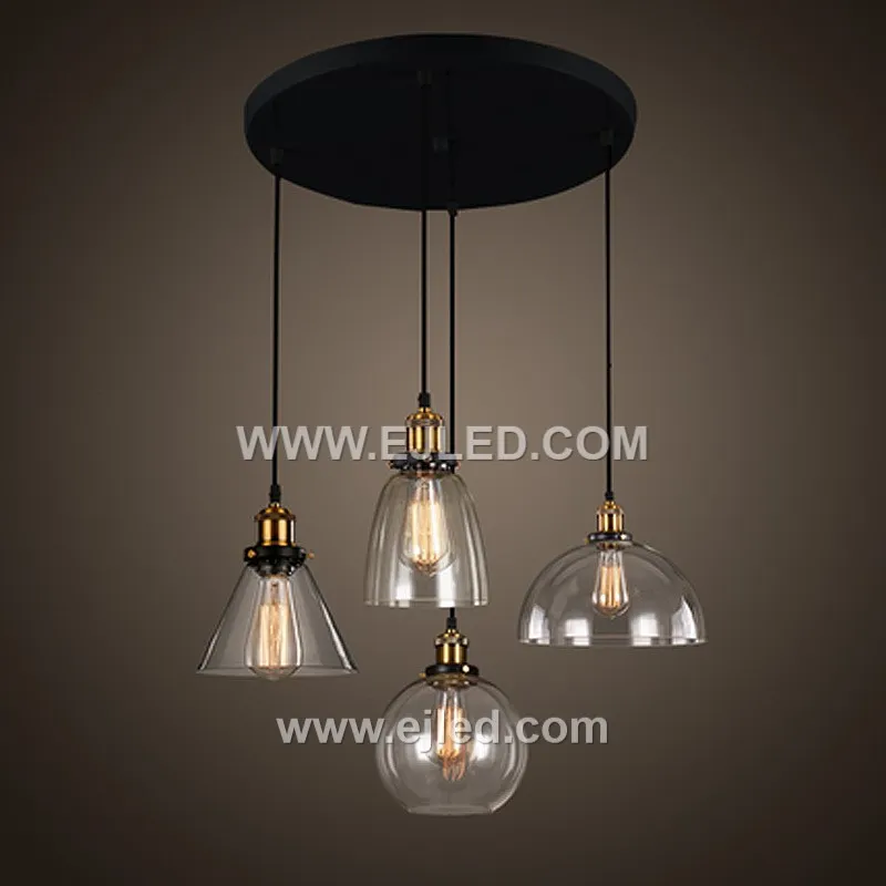 Model GL0016 features a clear, slightly flattened spherical glass shade with a wide bottom opening, accented by a substantial polished brass top. Its compact size and open design make it suitable for focused task lighting or as an accent in smaller spaces. - view 2
