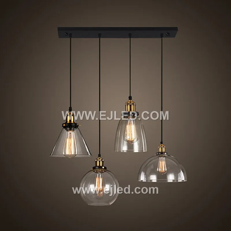 Model GL0016 features a clear, slightly flattened spherical glass shade with a wide bottom opening, accented by a substantial polished brass top. Its compact size and open design make it suitable for focused task lighting or as an accent in smaller spaces. - view 5