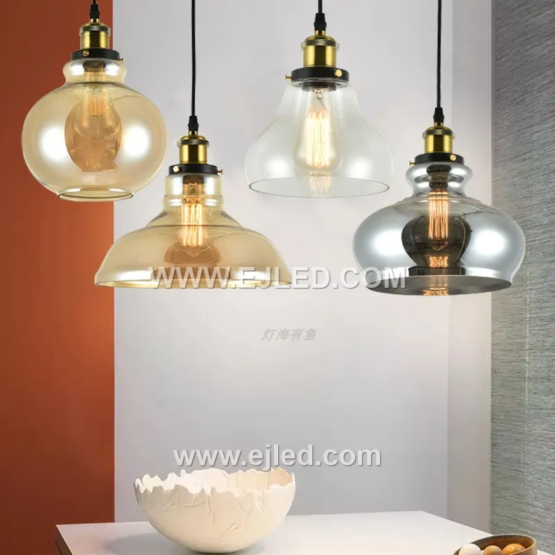 Model GL0016 features a clear, slightly flattened spherical glass shade with a wide bottom opening, accented by a substantial polished brass top. Its compact size and open design make it suitable for focused task lighting or as an accent in smaller spaces. - view 6