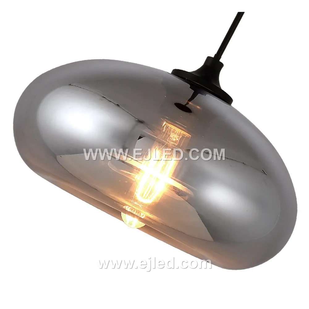 This dome-shaped glass pendant light, model GL0017, features a smoked grey finish that transitions from opaque at the top to clear at the bottom. This design effectively directs light downwards, reducing glare while highlighting the bulb within. - view 2
