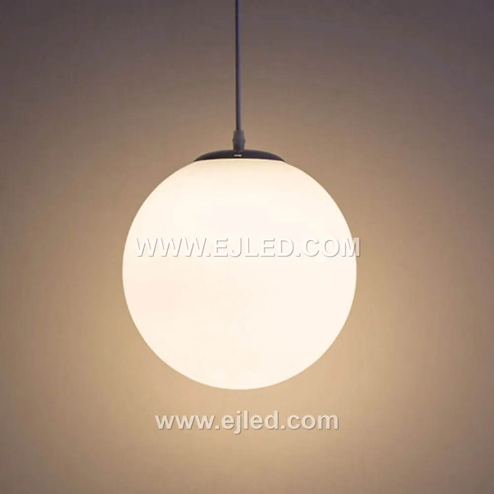 This multi-lamp pendant, model GL0020, features seven opaque white opal glass spheres suspended from a central chrome canopy. Designed to provide soft, diffused illumination, it creates a striking focal point for hospitality lobbies, stairwells, or residential dining areas. - view 5