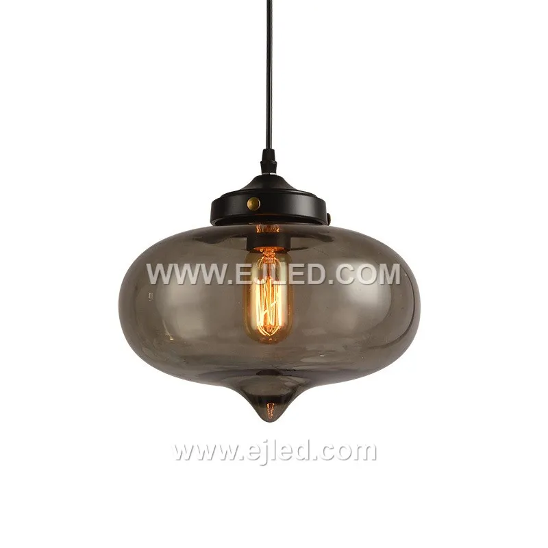 This single-lamp pendant light offers a unique ambient effect with its reflective, spherical glass shade. Model GL0044 suspends from a black fabric cord, projecting a distinct, semi-transparent quality when illuminated.