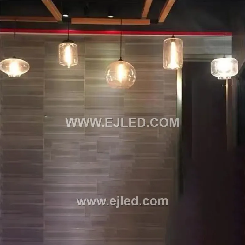 This single-lamp pendant light offers a unique ambient effect with its reflective, spherical glass shade. Model GL0044 suspends from a black fabric cord, projecting a distinct, semi-transparent quality when illuminated. - view 3