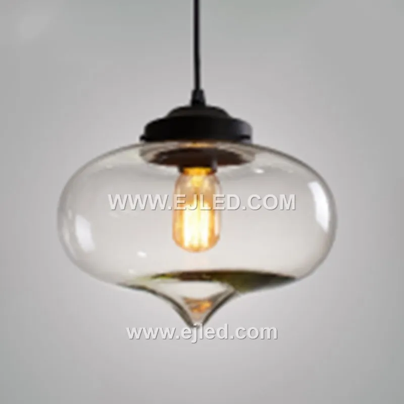 This single-lamp pendant light offers a unique ambient effect with its reflective, spherical glass shade. Model GL0044 suspends from a black fabric cord, projecting a distinct, semi-transparent quality when illuminated. - view 4