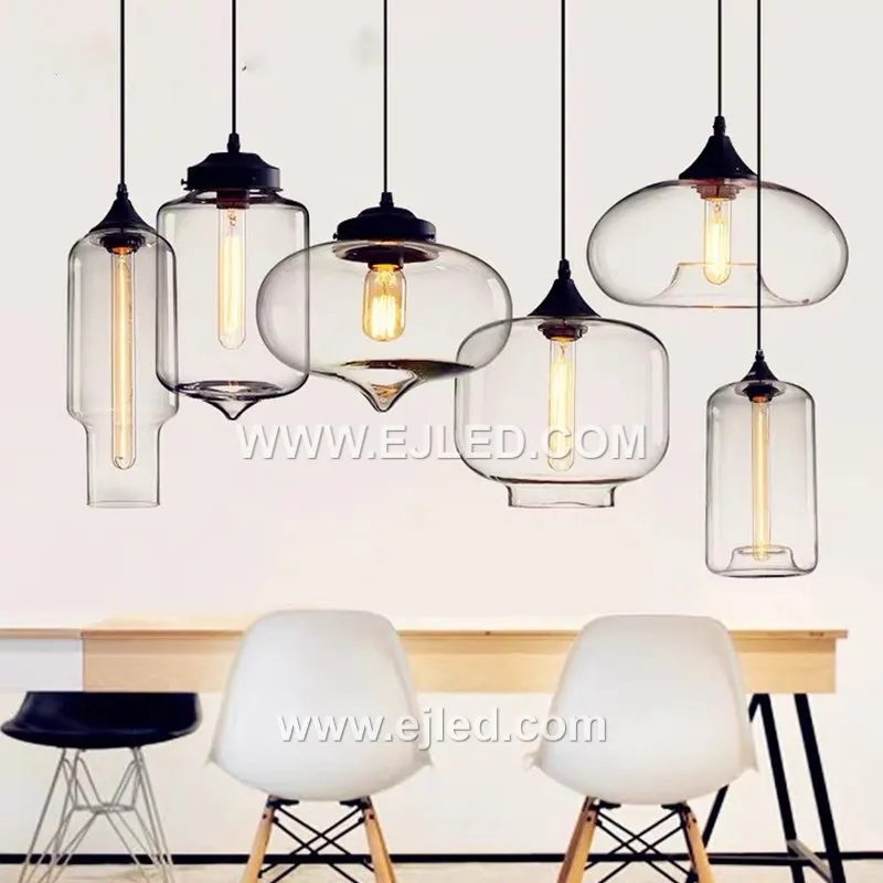 This single-lamp pendant light offers a unique ambient effect with its reflective, spherical glass shade. Model GL0044 suspends from a black fabric cord, projecting a distinct, semi-transparent quality when illuminated. - view 5
