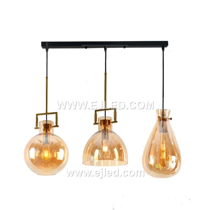 A compact cylindrical pendant light, model GL0055 features a clear, subtly flared glass shade. Its small scale suits intimate settings or can be grouped for impact, providing direct and ambient light. - view 2