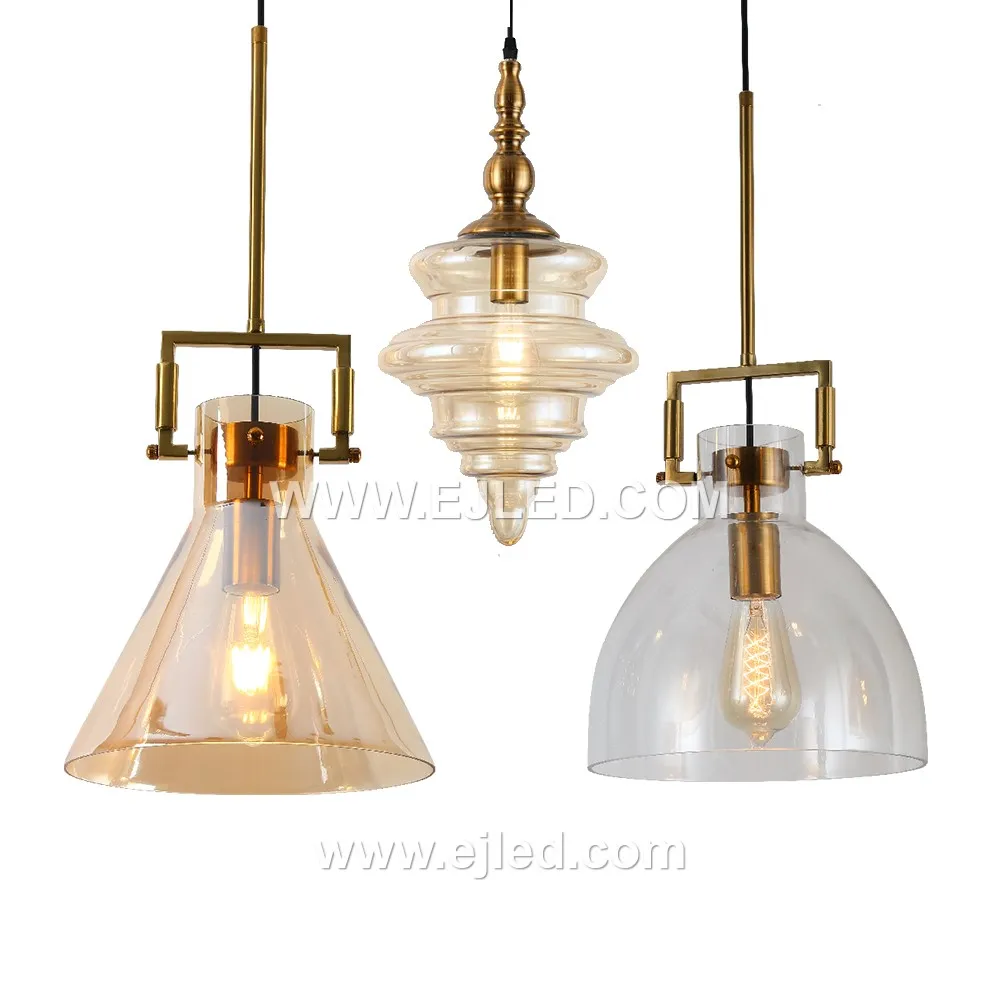 A compact cylindrical pendant light, model GL0055 features a clear, subtly flared glass shade. Its small scale suits intimate settings or can be grouped for impact, providing direct and ambient light. - view 3