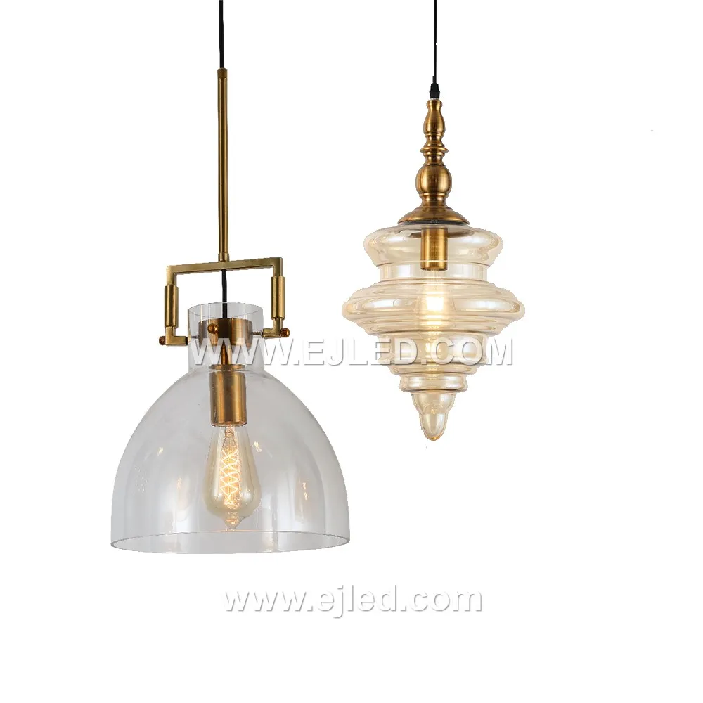 A compact cylindrical pendant light, model GL0055 features a clear, subtly flared glass shade. Its small scale suits intimate settings or can be grouped for impact, providing direct and ambient light. - view 5