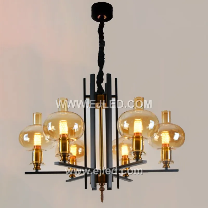 Ideal for a statement in a living room or foyer, this eight-lamp pendant light, model GL0083, features an angular brass frame. White spherical glass shades diffuse the light from each lamp, creating broad, gentle illumination.