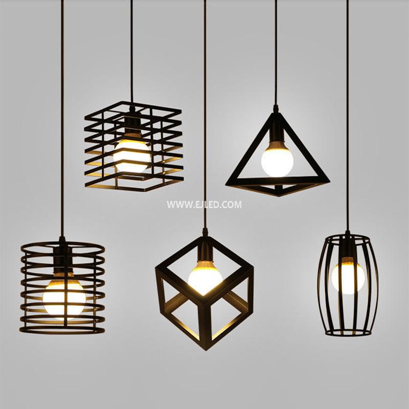 This cylindrical pendant light distinguishes itself with a unique spring coil design, crafted from black-finished iron. Its single, exposed lamp holder provides direct illumination while making the bulb a visual feature. - view 4
