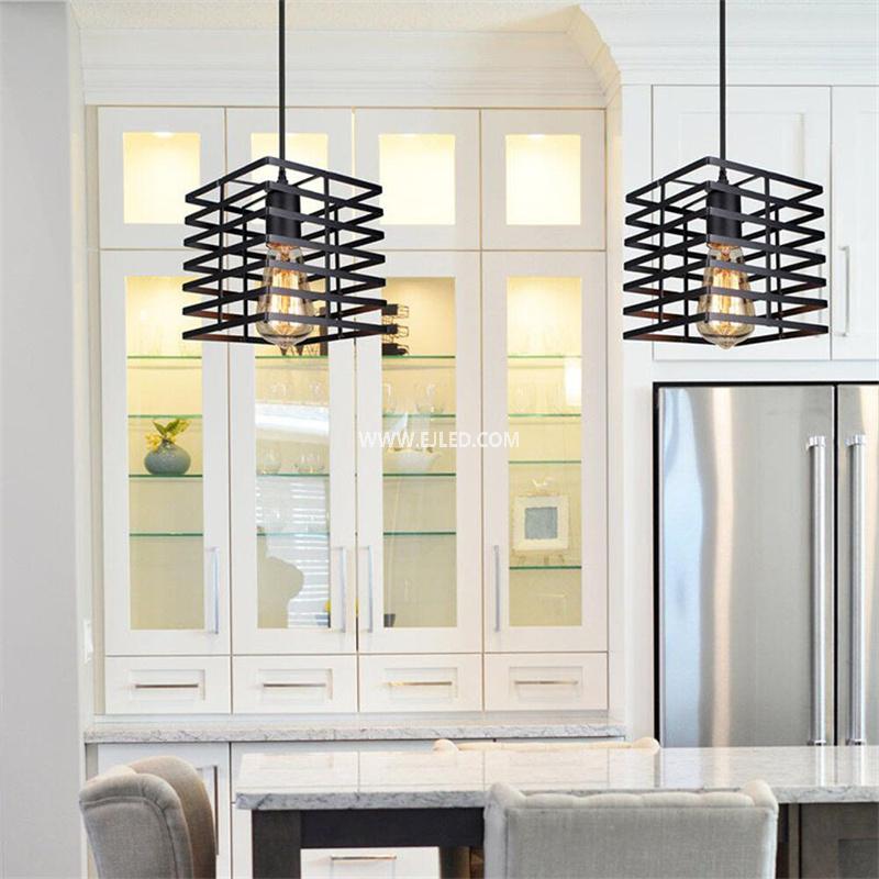 This square-shaped pendant light features an open wire cage in black, housing a single exposed lamp. Its compact proportions are well-suited for smaller rooms or installations in a series over kitchen islands or bars. - view 3