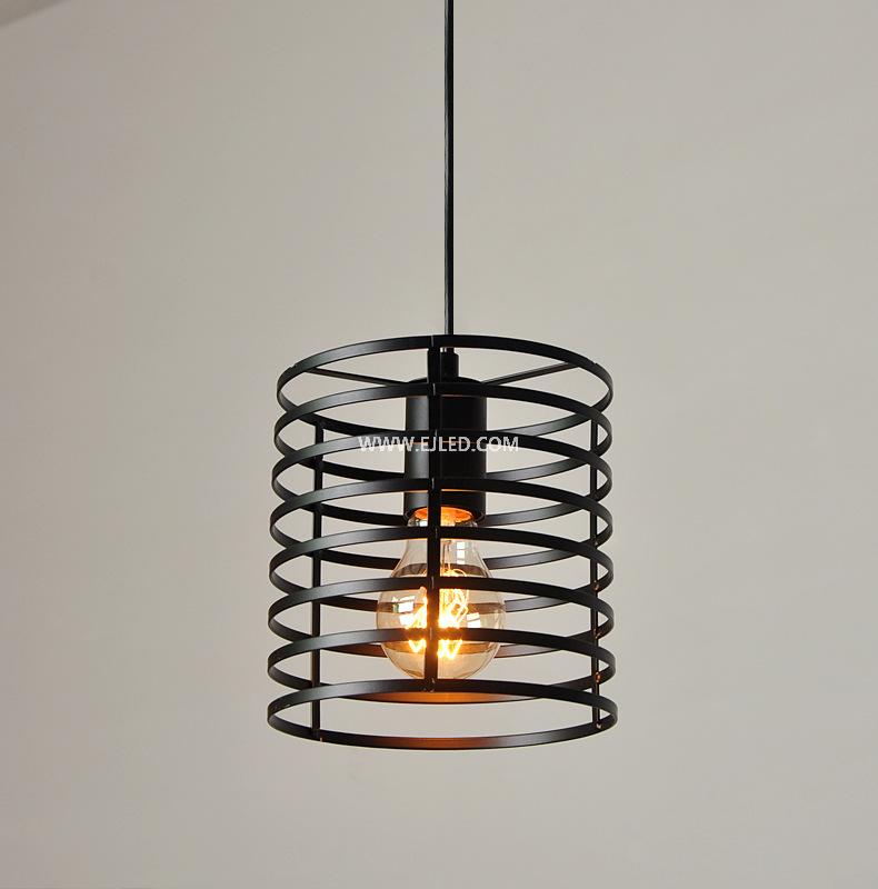 This cylindrical pendant light distinguishes itself with a unique spring coil design, crafted from black-finished iron. Its single, exposed lamp holder provides direct illumination while making the bulb a visual feature. - view 3