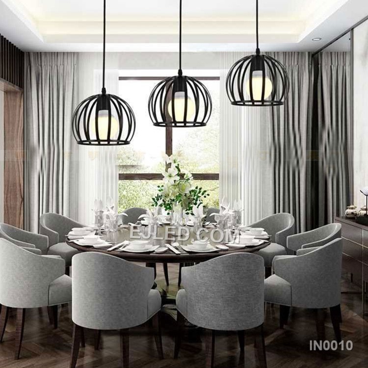 This IN0010 iron pendant light features a solid, semi-circular dome shade with a matte black exterior and white interior, holding a single E27 lamp. It hangs by a black cable. - view 5