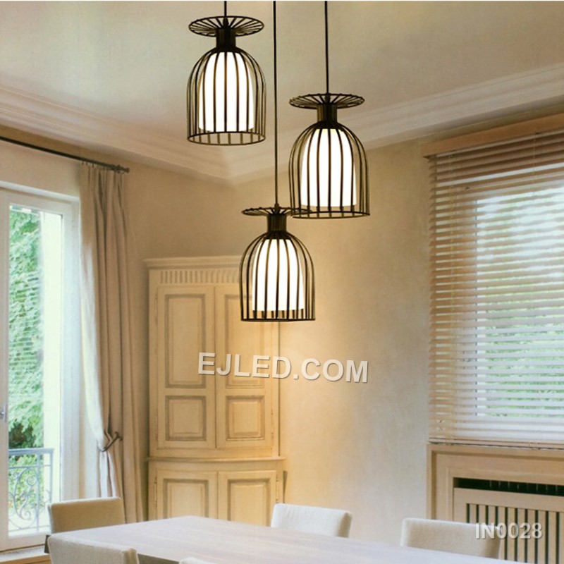 Model IN0028 is a black iron bell-shaped pendant light, notable for its wide, open cage design. The expansive form, crafted from thin iron bars, allows significant light output from a single lamp, suitable for areas needing broad illumination. - view 6