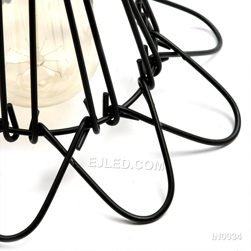 Iron forms the flared cylindrical cage of this pendant light, finished in a durable black powder coat. Its open structure and single exposed lamp are designed for direct, unobstructed illumination. - view 4