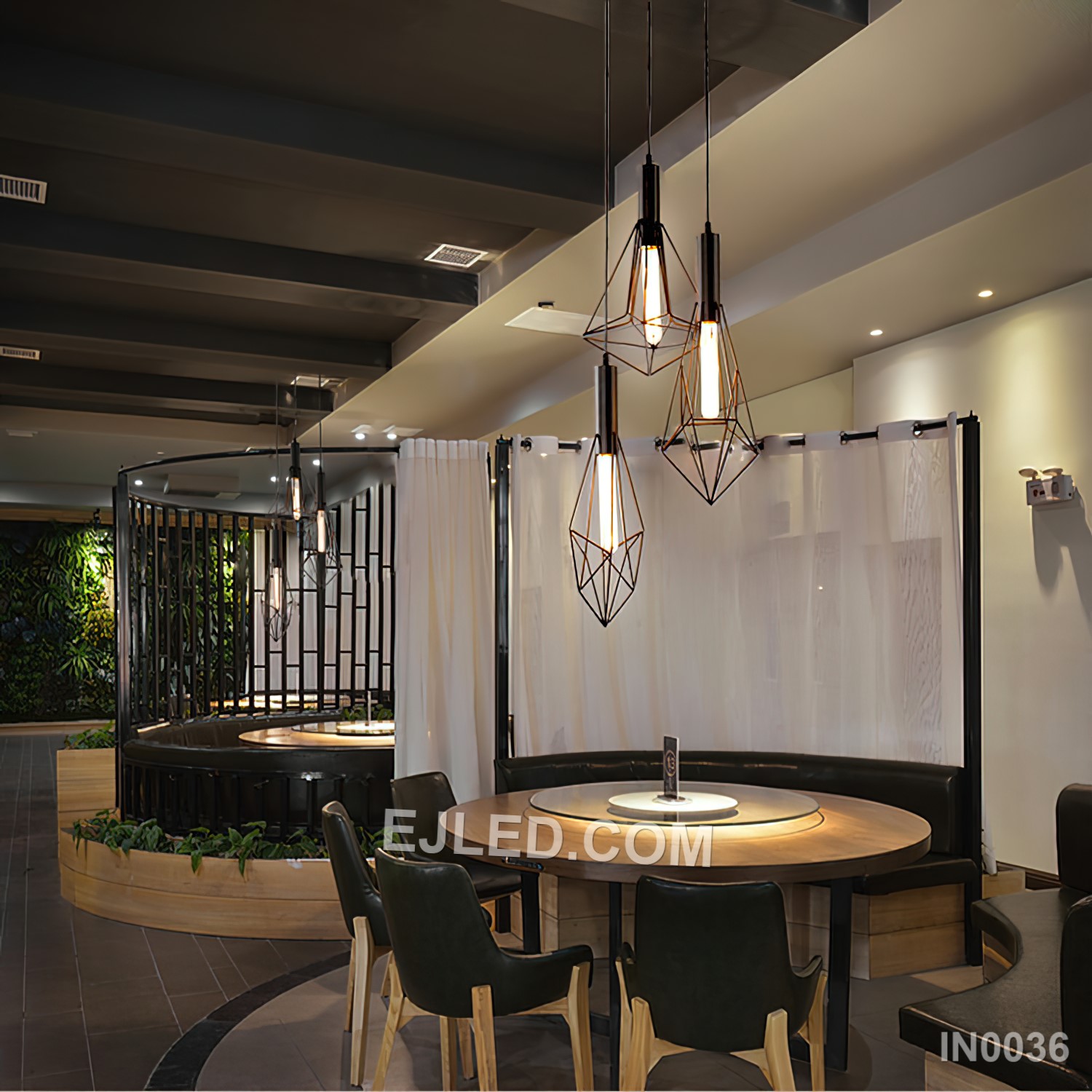 Three diamond-shaped cages, each constructed from black-finished iron rods, form the striking IN0036 pendant light. Suspended at varied heights from a single canopy, these open fixtures provide focused illumination and a strong visual statement. - view 3
