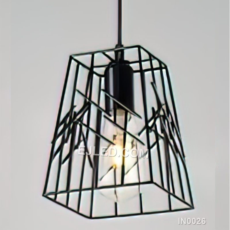 Model IN0026 is a single iron pendant light, distinguished by its black cylindrical cage. This open shade design features a dense arrangement of vertical bars, providing a defined visual form while allowing ample light to escape from its single lamp.
