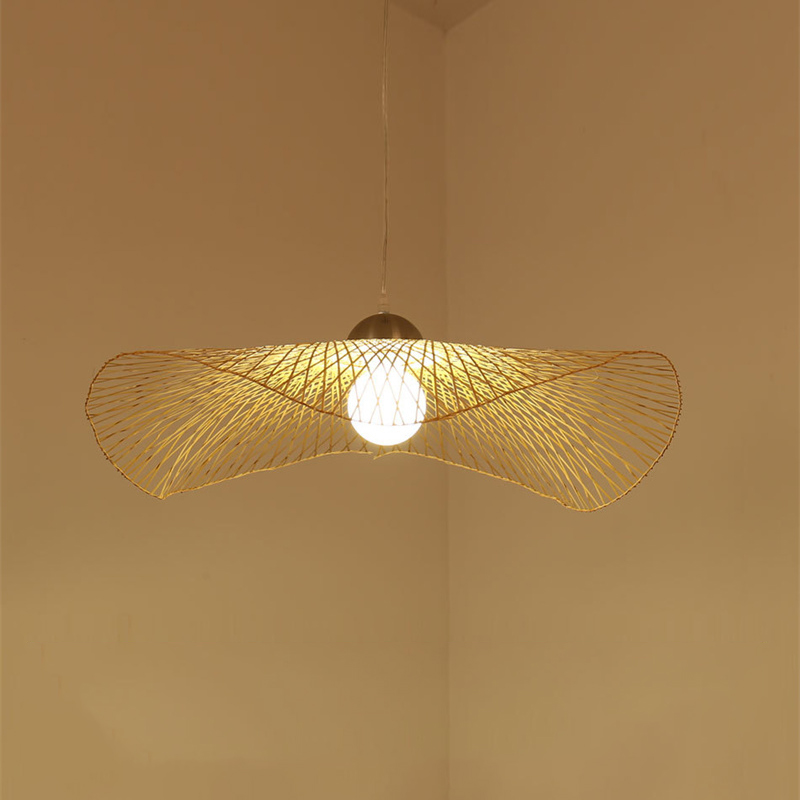 Model RT0033 features a wide, conical bamboo pendant shade, hand-woven with a natural finish. Its expansive open bottom directs a broad light spread, ideal for illuminating larger surfaces like dining tables or reception desks. - view 2