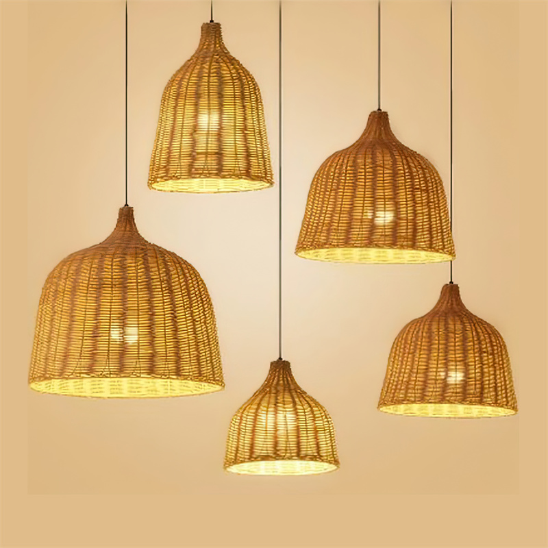 A single lamp bell-shaped pendant, hand-woven from natural rattan, creates a warm, diffused light. Its open weave and earthy texture make it suitable for intimate dining areas, hotel lobbies, or relaxed retail environments seeking a natural aesthetic. - view 3