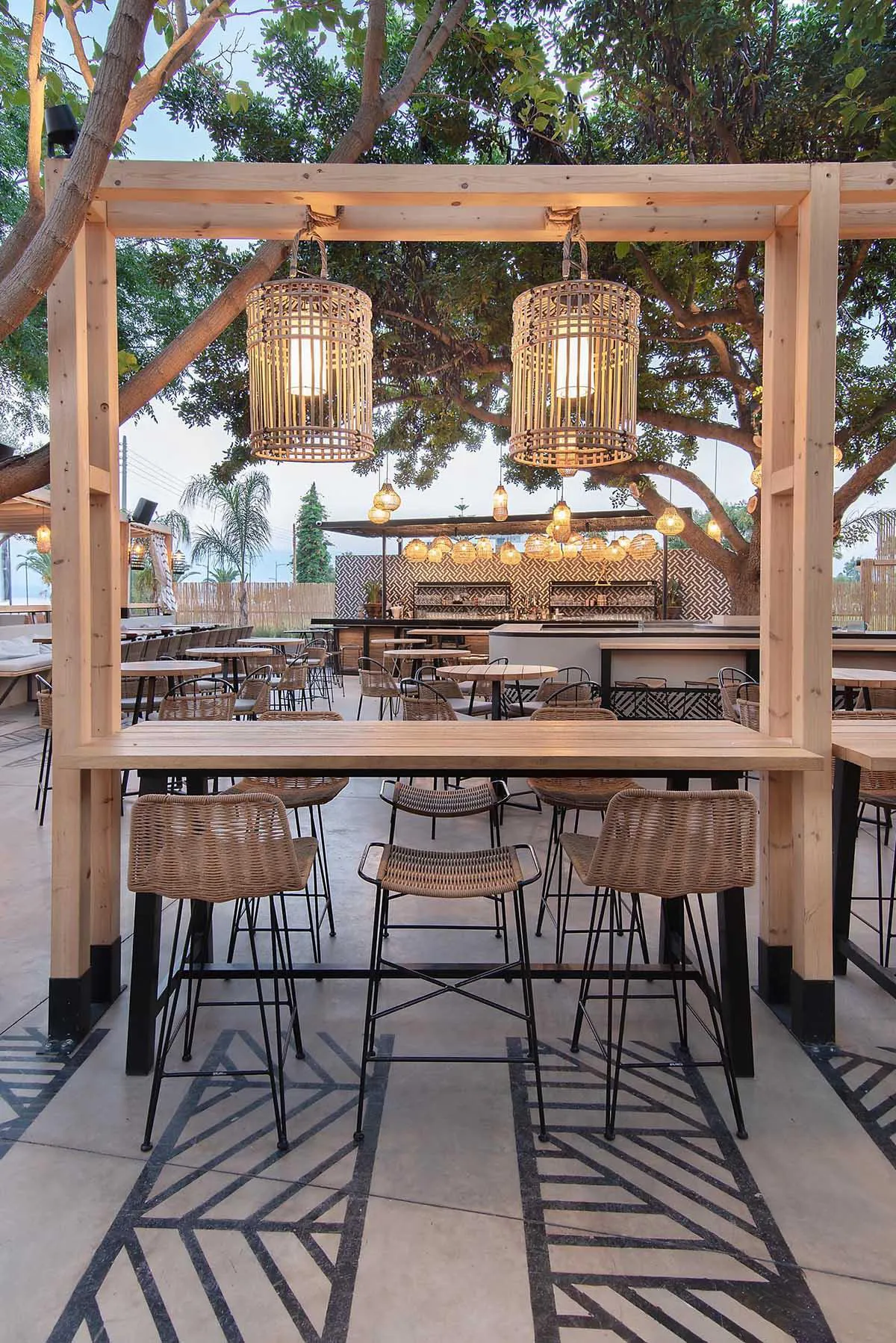 Screens made of reeds add beachy aesthetic to this bar and restaurant