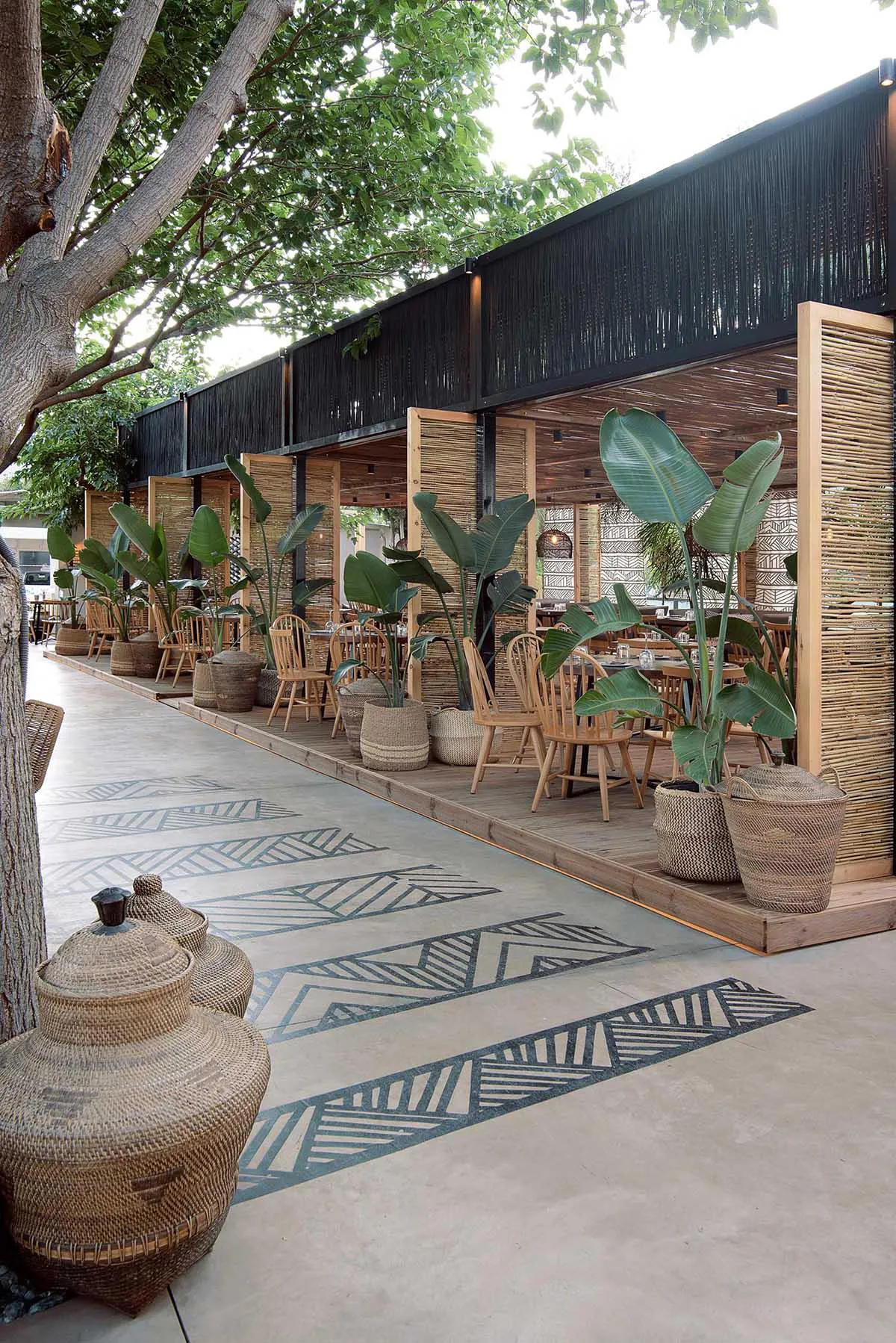 Screens made of reeds add beachy aesthetic to this bar and restaurant