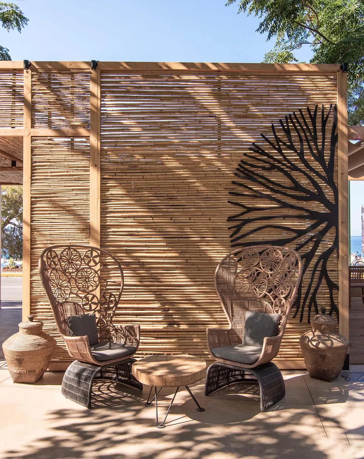 Screens made of reeds add beachy aesthetic to this bar and restaurant