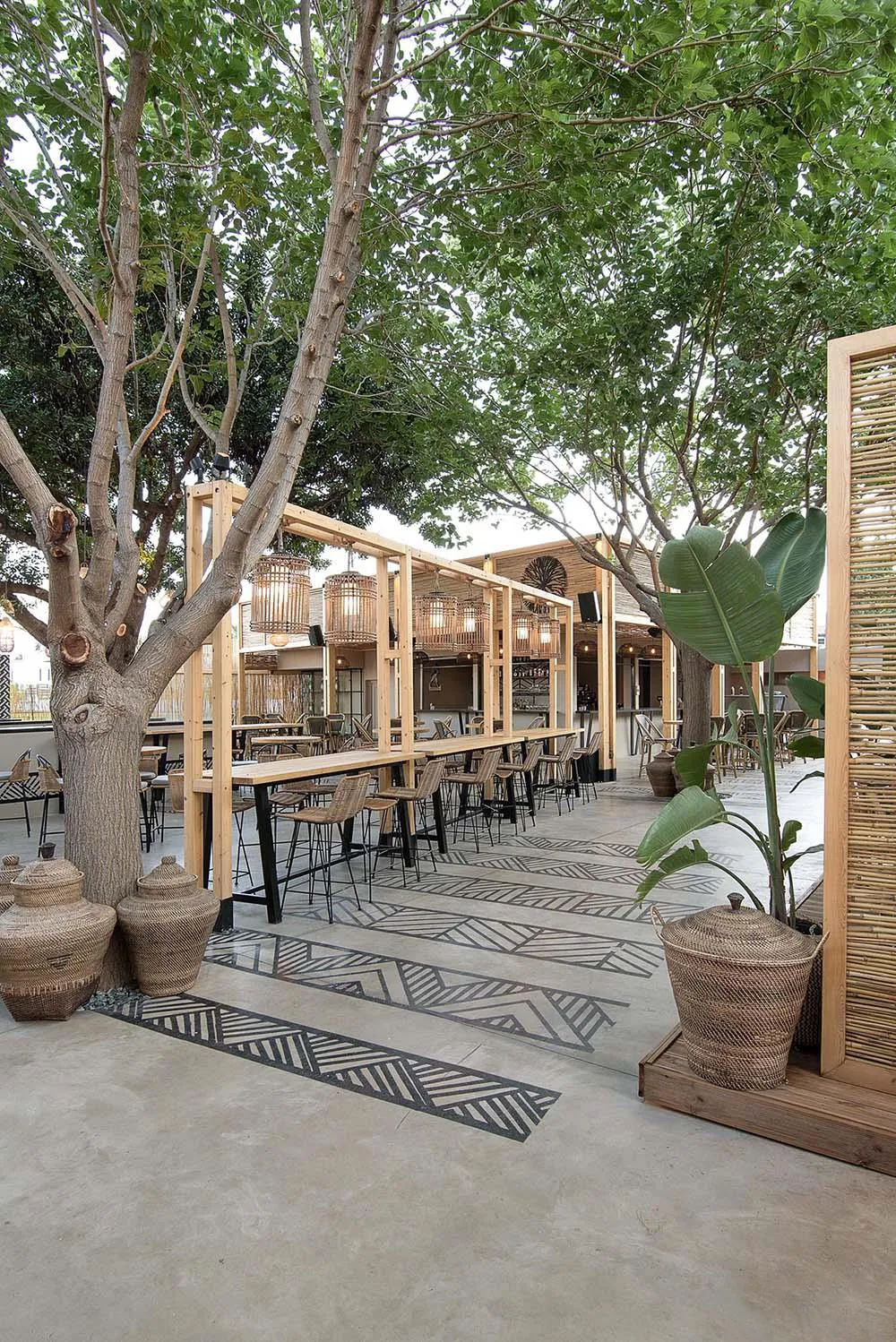 Screens made of reeds add beachy aesthetic to this bar and restaurant