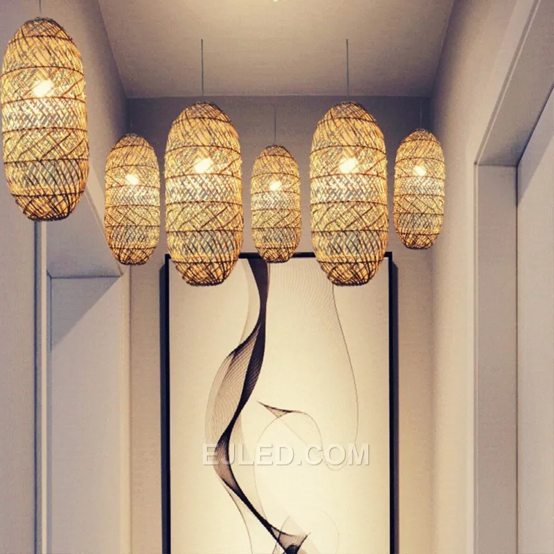 Hand-woven from natural bamboo, the RT0005 oval pendant directs light downward while allowing some ambient glow through its open weave. Its elongated form is suitable for task lighting or accentuating specific areas. - view 4