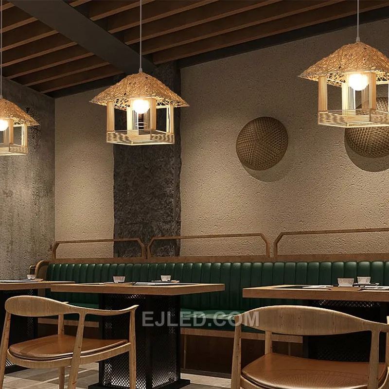 The RT0020 bamboo pendant features a distinctive multi-tiered, pagoda-like shade, hand-woven to create an open structure that diffuses light effectively. Its architectural form suits spaces seeking a unique natural design element. - view 3