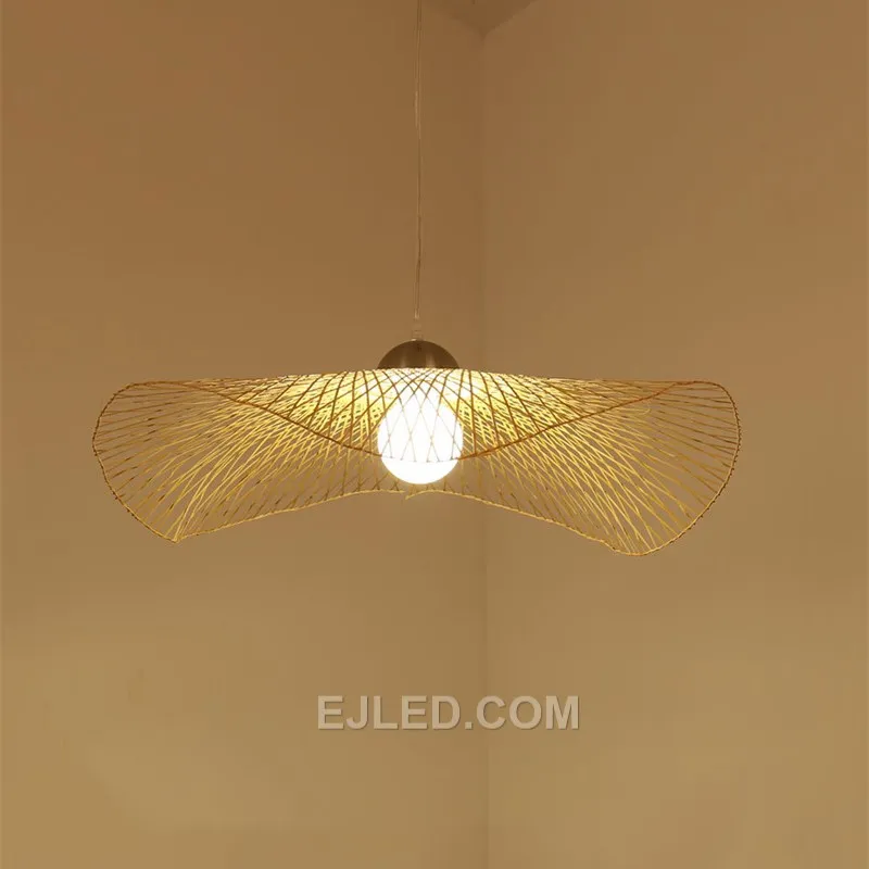 This bamboo pendant stands out with its unique, waisted bell silhouette, offering a departure from conventional dome or basket designs. Its dense weave directs light primarily downwards. - view 5