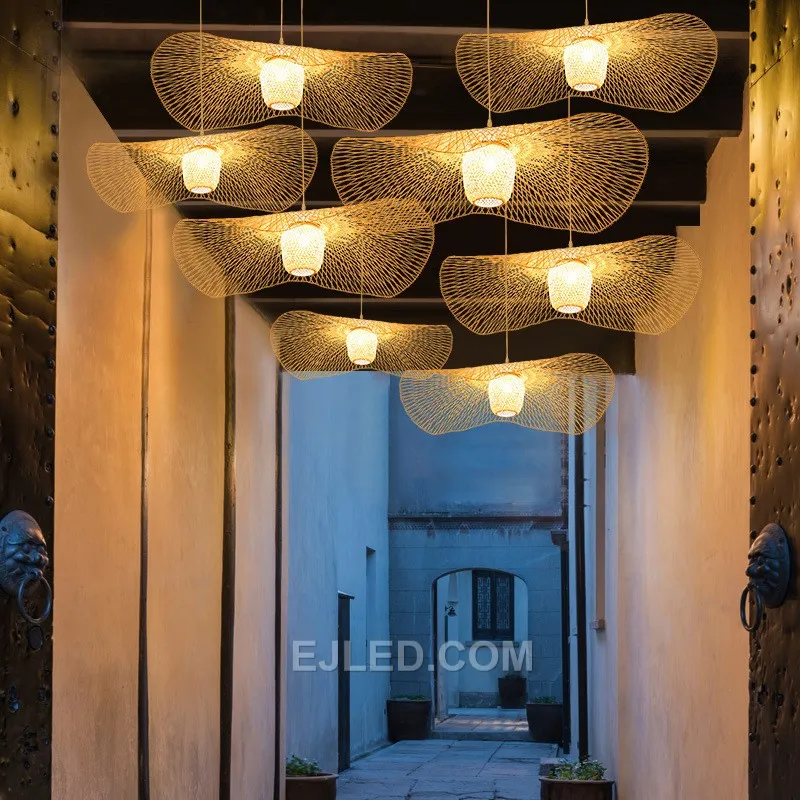 This bamboo pendant stands out with its unique, waisted bell silhouette, offering a departure from conventional dome or basket designs. Its dense weave directs light primarily downwards. - view 2