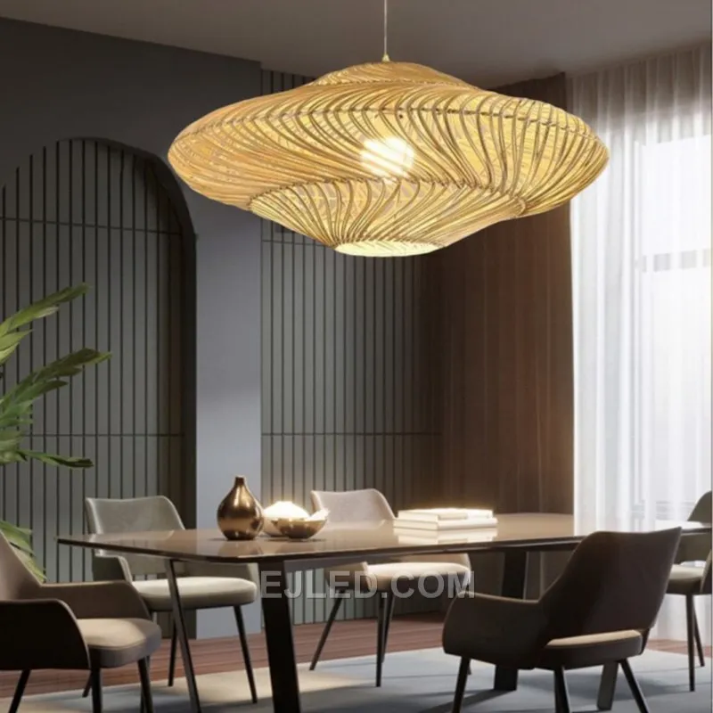 An elongated oval shape woven from natural bamboo distinguishes this pendant, which casts diffuse light through its open-weave construction and unique texture. - view 3