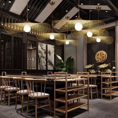 This bamboo pendant stands out with its unique, waisted bell silhouette, offering a departure from conventional dome or basket designs. Its dense weave directs light primarily downwards. - view 4