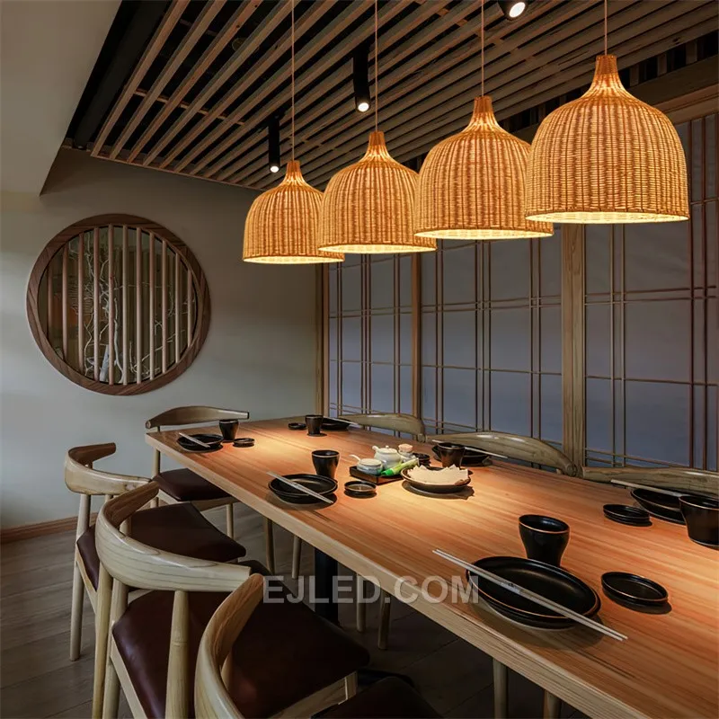 This bell-shaped rattan pendant directs light downwards through its open bottom rim. Its woven construction allows some ambient glow through the upper, looser weave, while the denser central section mitigates direct glare. - view 6
