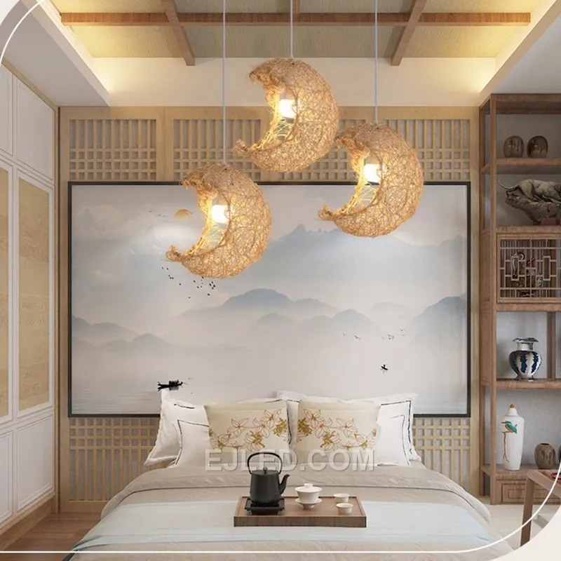 The RT0019 is a drum-shaped rattan pendant featuring a distinct open weave at the bottom, allowing for a focused downward light while casting diffuse ambient illumination through its sides. It hangs from a simple cable. - view 3