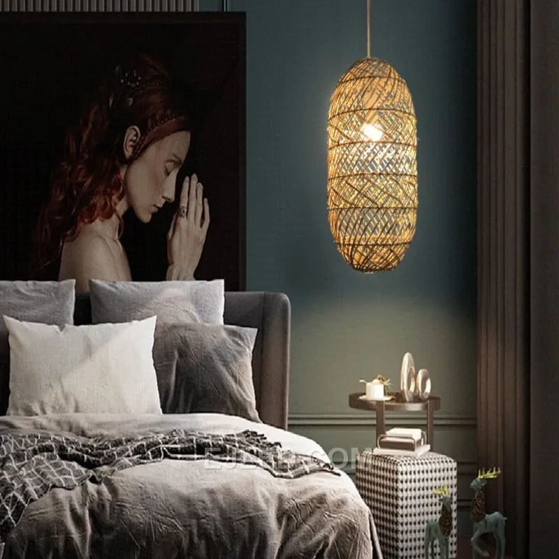 Hand-woven from natural bamboo, the RT0005 oval pendant directs light downward while allowing some ambient glow through its open weave. Its elongated form is suitable for task lighting or accentuating specific areas. - view 2