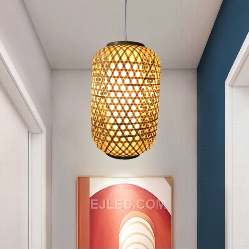 A cylindrical pendant, the RT0016 features open ends and a tall, narrow profile woven from natural bamboo. It provides focused downlight while diffusing illumination radially. - view 2