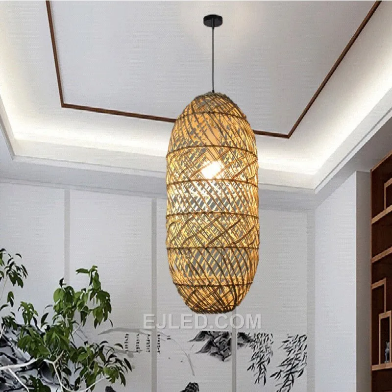 Hand-woven from natural bamboo, the RT0005 oval pendant directs light downward while allowing some ambient glow through its open weave. Its elongated form is suitable for task lighting or accentuating specific areas. - view 3