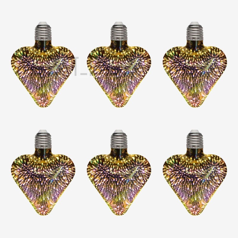 This clear glass heart shaped 3D galaxy LED bulb features an iridescent firework pattern inside the shade and a standard screw base. - view 5