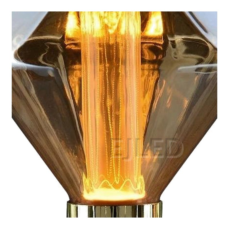This amber glass light guide LED bulb features a geometric diamond shape with an upright cylindrical filament and a standard screw base. - view 3