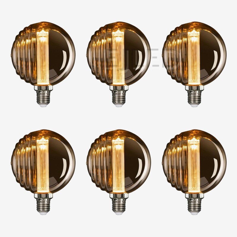 This amber glass light guide LED bulb features a ribbed shade design and an internal vertical light source, creating a warm vintage decorative effect. - view 5