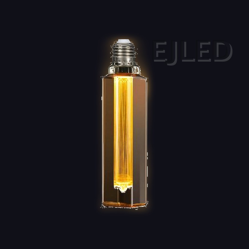 This amber glass rectangular tubular LED bulb features a vertical internal light guide filament. It connects with a standard screw base for decorative lighting fixtures. - view 2