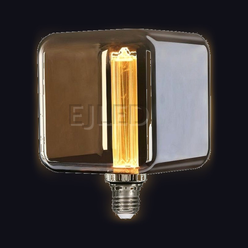 This amber glass square LED bulb features a vertical filament lamp inside a tinted glass shade, designed for architectural lighting projects and commercial wholesale supply. - view 2