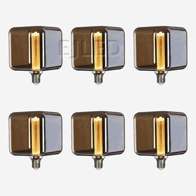 This amber glass square LED bulb features a vertical filament lamp inside a tinted glass shade, designed for architectural lighting projects and commercial wholesale supply. - view 5