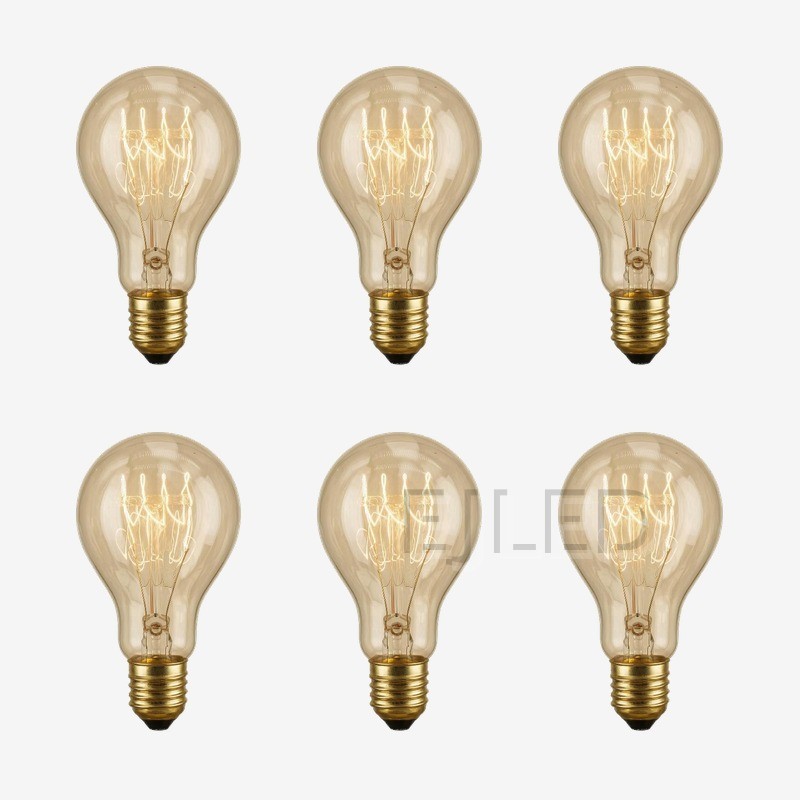 This amber glass retro light bulb features visible tungsten filaments inside a classic teardrop shaped enclosure, mounted on a brass threaded base. - view 5